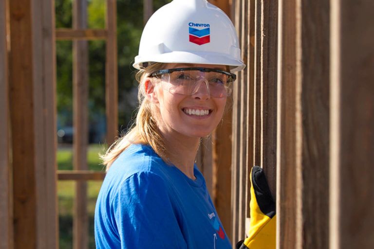 Chevron Worker helping build a house
