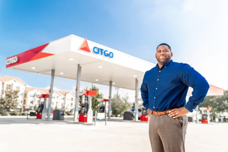 Citgo Petroleum Corporation fuel station owner in front of his business