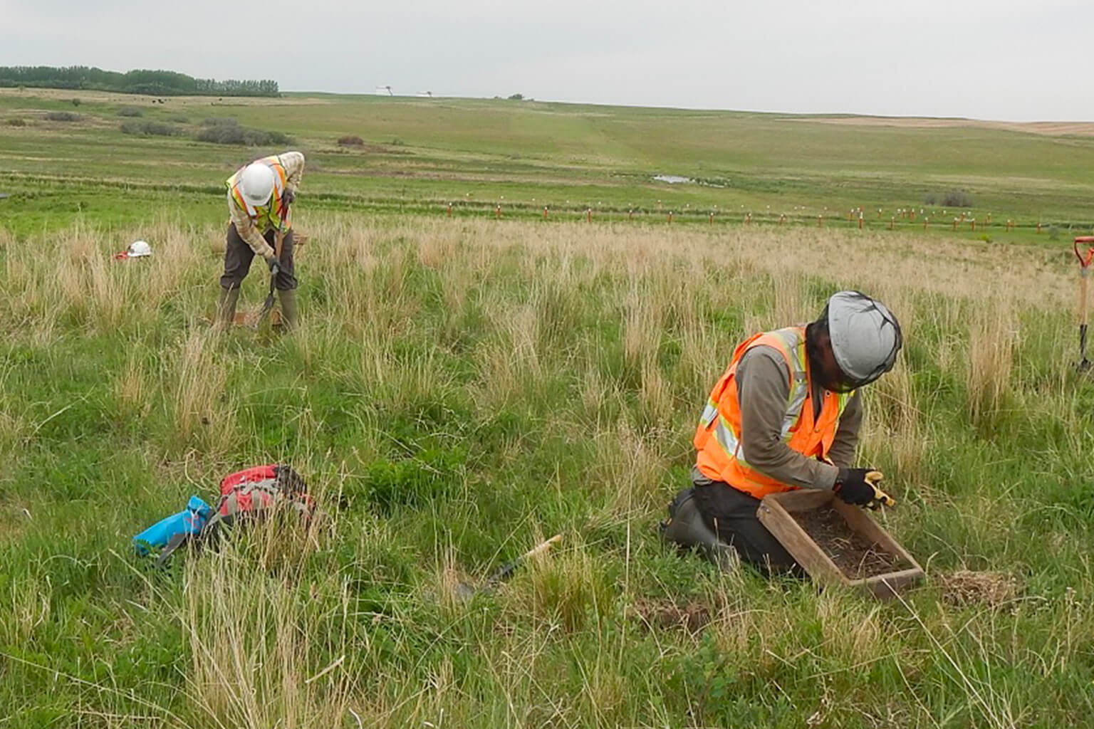 Enbridge employees collecting soil samples