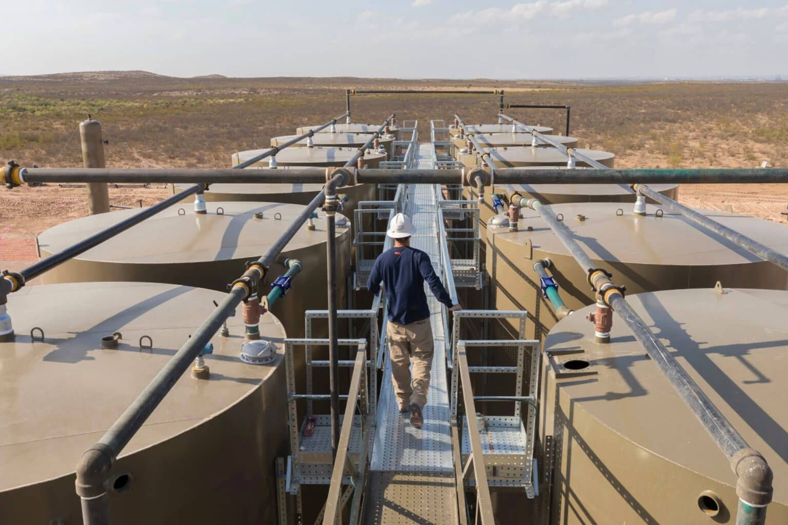 Marathon employee on catwalk of refinery