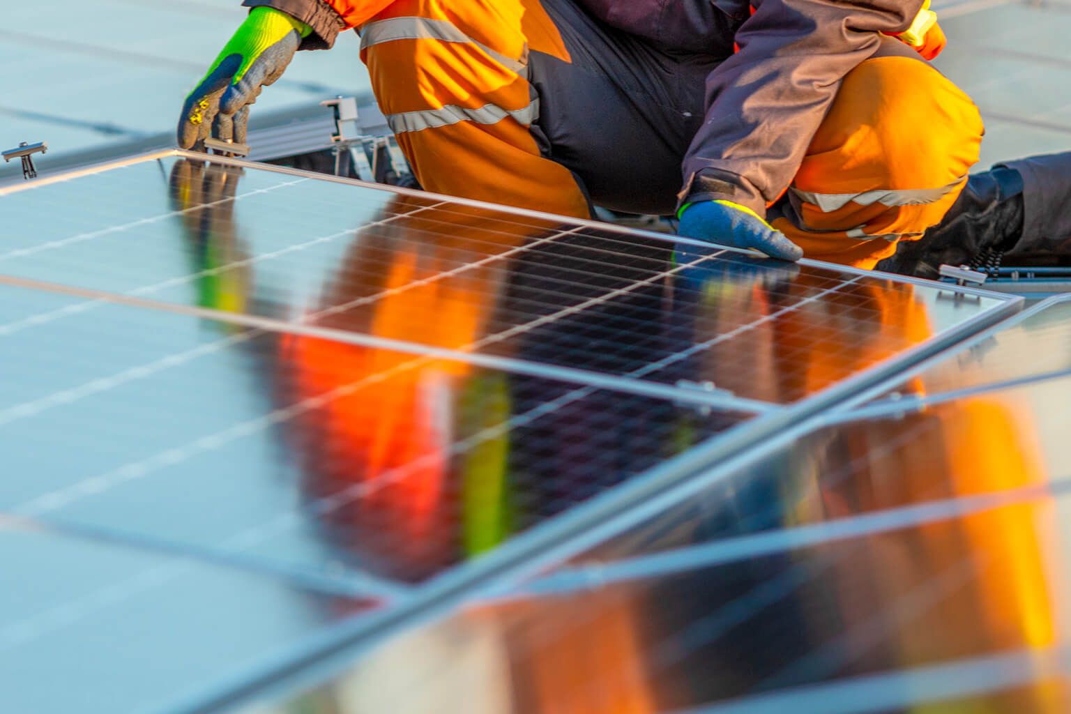 Person installing solar panels