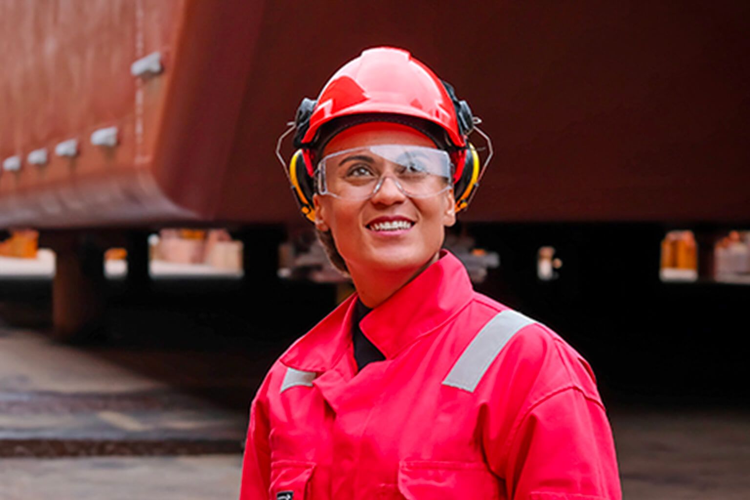 Person wearing hardhat and safety glasses